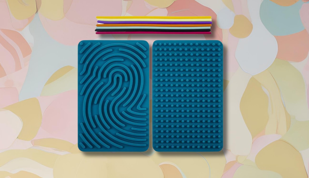 A double sided sensory activity board with various textures, along with a storage bag and a set of elements such as foam strips.